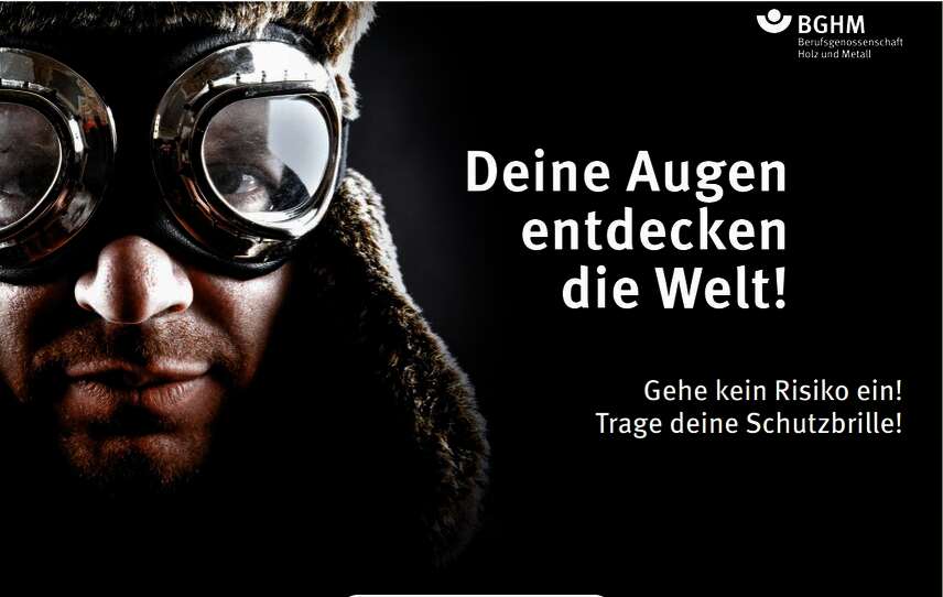 Mann mit einer Schutzbrille, Schriftzug "Wir entdecken die Welt"