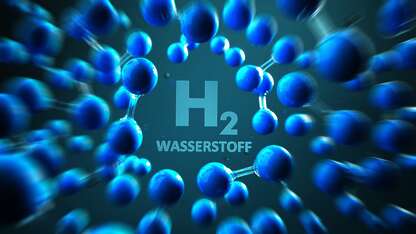 Adobe Stock Foto: Schriftzug H2 Wasserstoff und Darstellung von Melokülen, blauer Hintergrund